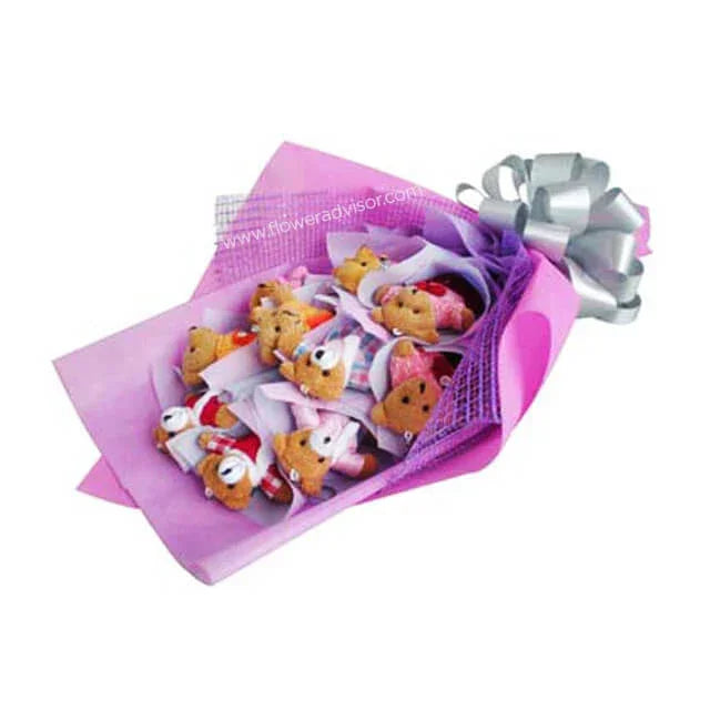 Bouquet of cute teddy bear plush toys wrapped in purple paper with a silver ribbon.