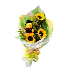 Graduation teddy bear and sunflower bouquet with yellow ribbon, wrapped in green paper