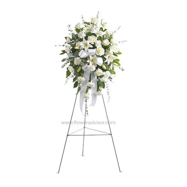 Elegant white floral standing wreath with roses, lilies, and green foliage, ideal for flower delivery in Kuala Lumpur