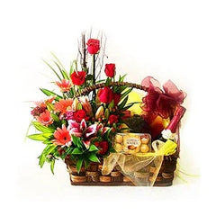 FlowerAdvisor Malaysia gift basket with red roses, pink lilies, assorted flowers, and Ferrero Rocher chocolates
