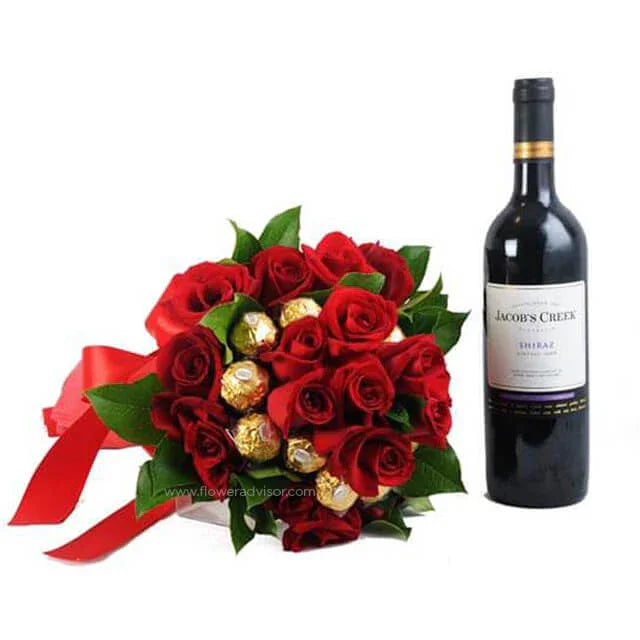 Bouquet of red roses with chocolates wrapped in gold foil and a bottle of Jacob's Creek Shiraz wine