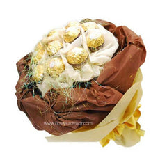 Bouquet of Ferrero Rocher chocolates wrapped in brown and beige paper with decorative netting