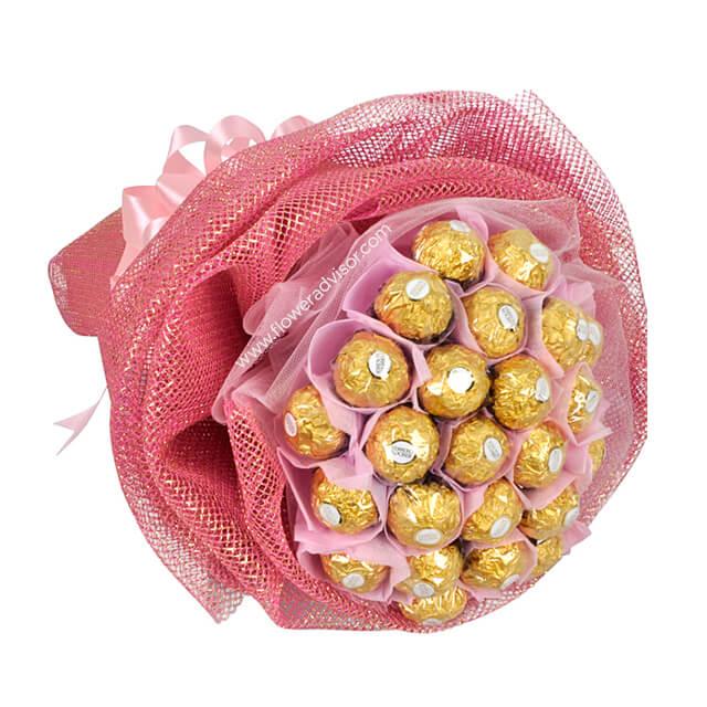 Ferrero Rocher chocolate bouquet wrapped in pink mesh and ribbons, luxury gift arrangement