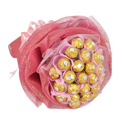 Ferrero Rocher chocolate bouquet wrapped in pink mesh and ribbons, luxury gift arrangement