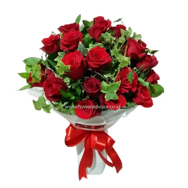 Bouquet of fresh red roses with green leaves tied with a red ribbon, flower delivery