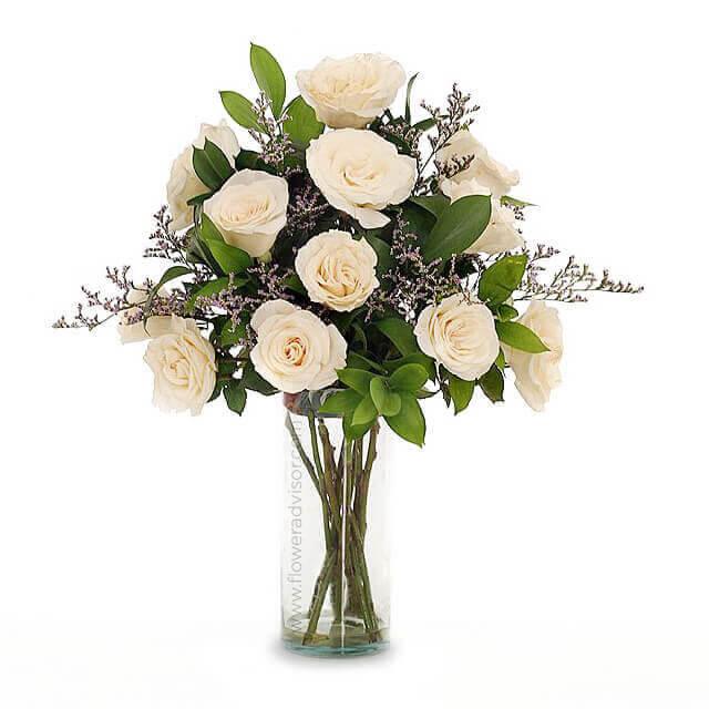 Elegant bouquet of cream roses and greenery in clear glass vase, fresh flower arrangement by FlowerAdvisor Malaysia