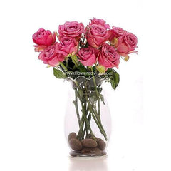 Bouquet of fresh pink roses in a clear glass vase with decorative stones, from FlowerAdvisor Malaysia