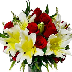 Bouquet of red roses and yellow-white lilies with green foliage on white background