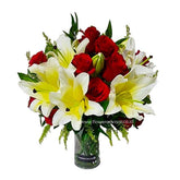 Elegant bouquet of red roses and yellow white lilies in a clear glass vase from FlowerAdvisor Malaysia