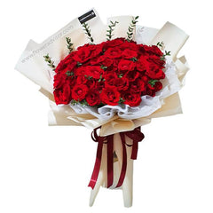 Large bouquet of fresh red roses wrapped in cream and white paper with red ribbon, FlowerAdvisor Malaysia