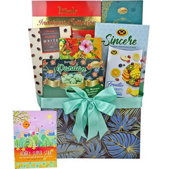 FlowerAdvisor Malaysia gift hamper with assorted snacks and cookies wrapped with a teal ribbon