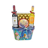 Gift basket with Monte Rosso red wine, Moscato white wine, chocolates, and teddy bear tin, decorated with blue ribbon and floral design