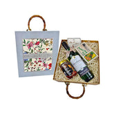 Special gifts box with wine bottle, honey jar, tea pack, and floral tote bag, ideal for gift delivery