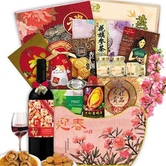 Chinese New Year gift hamper with wine, assorted snacks, tea, cookies, and festive packaging