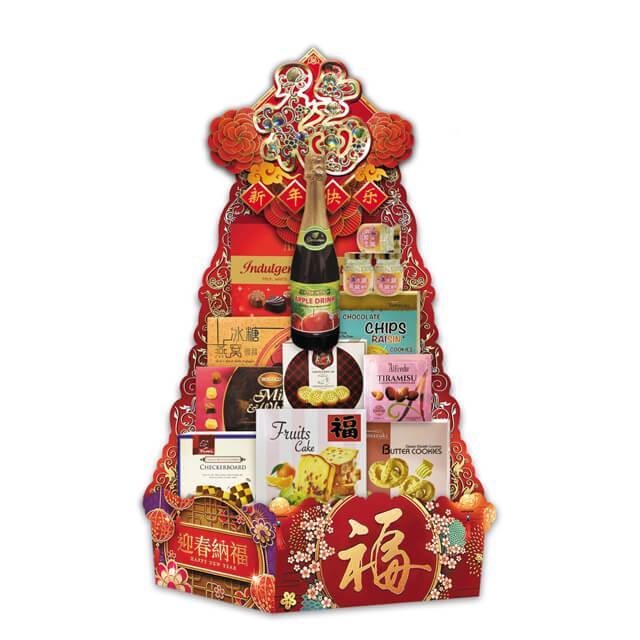 Chinese New Year gift basket with apple drink, chocolates, cookies, and festive red floral packaging