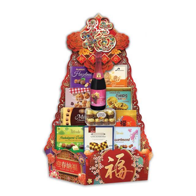 Chinese New Year festive hamper with assorted snacks, chocolates, cookies and a sparkling drink.