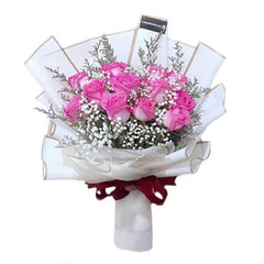 Bouquet of fresh pink roses with white baby's breath wrapped in white paper with maroon ribbon from FlowerAdvisor Malaysia