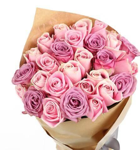 Bouquet of fresh pink and purple roses wrapped in brown paper, ideal for flower delivery in Kuala Lumpur