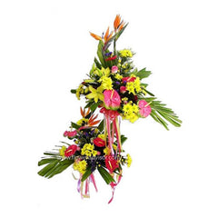 Colorful two-tier standing flower arrangement with yellow lilies, pink anthuriums, birds of paradise, and green leaves
