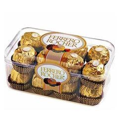 Ferrero Rocher chocolates in transparent plastic box with golden foil wrapping