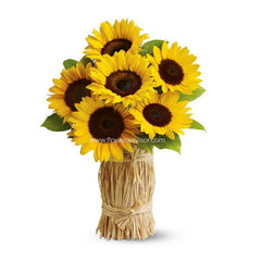 Bright sunflower bouquet wrapped in natural raffia, fresh yellow flowers with green leaves, ideal for flower delivery in Kuala Lumpur
