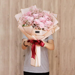Raining Kisses - 12 pink roses hand bouquet with baby's breath