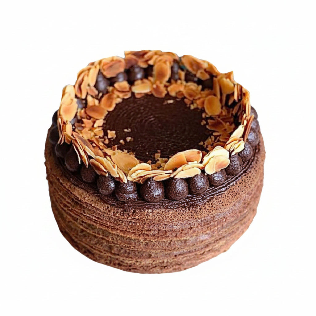 Double chocolate mille crepe cake with almond flakes