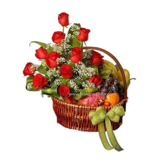 Wicker basket with red roses, white baby's breath, green leaves, and mixed fresh fruits, decorated with green bow