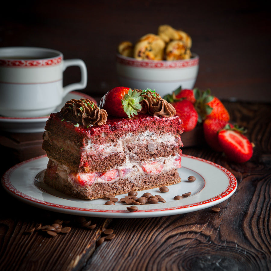 Cake slice and tea representing cake choices for different celebrations