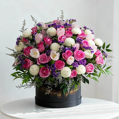 Luxury flower box with pink roses, white chrysanthemums, tulips, and purple fillers
