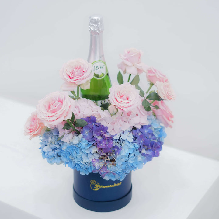 Cherish Bloom Charm - red roses and hydrangea with sparkling water bottle