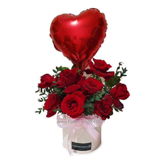 Passion Wonder bloom box with eight red roses and a red heart balloon