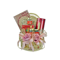 Elegant gift basket with red tins, jars, decorative pink flowers, and traditional packaging for flower delivery Malaysia