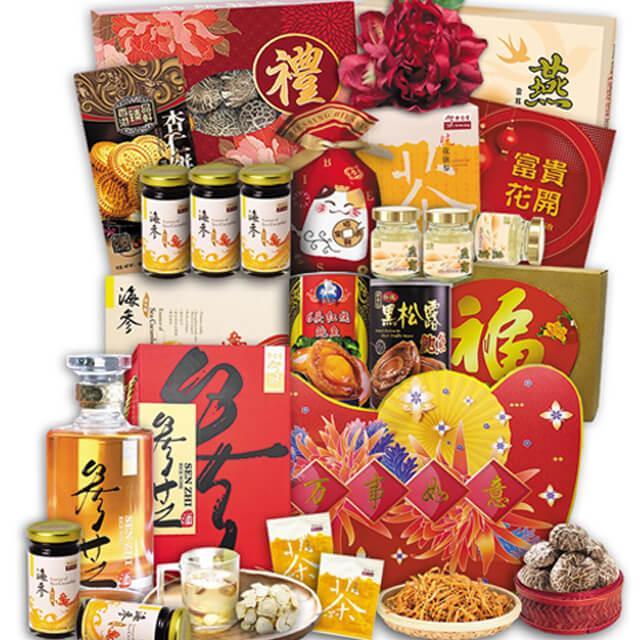 Chinese New Year festive hamper with assorted snacks, health drinks, and gift boxes
