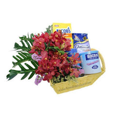 Flower arrangement gift basket with red orchids, oatmeal, biscuits, and health drinks