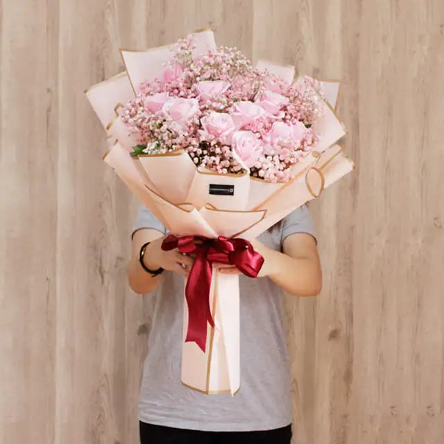 Raining Kisses - 12 pink roses hand bouquet with baby's breath