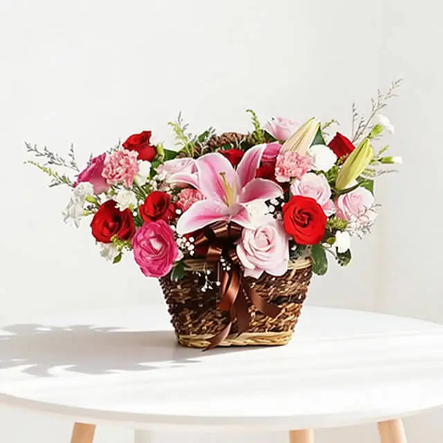 Red rose, lily and carnation flower basket with baby's breath