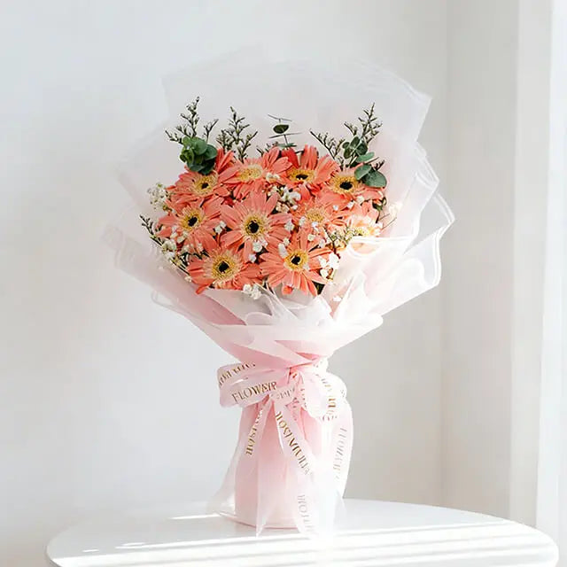 Pink gerbera hand bouquet with eucalyptus, caspia and baby's breath
