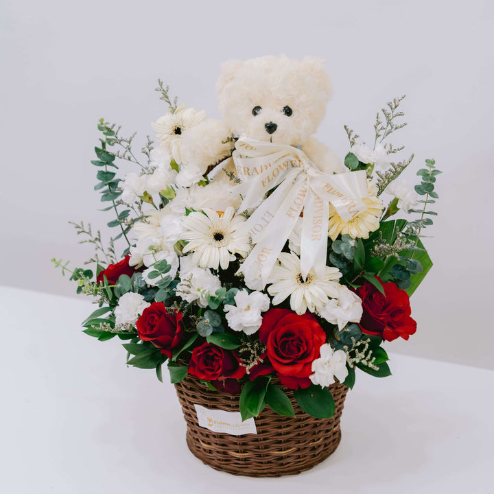 Teddy Serene Hues - red roses and white gerbera basket with teddy bear